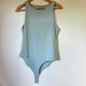 NWT BABY BLUE SLEEVELESS BODYSUIT SIZE M/L